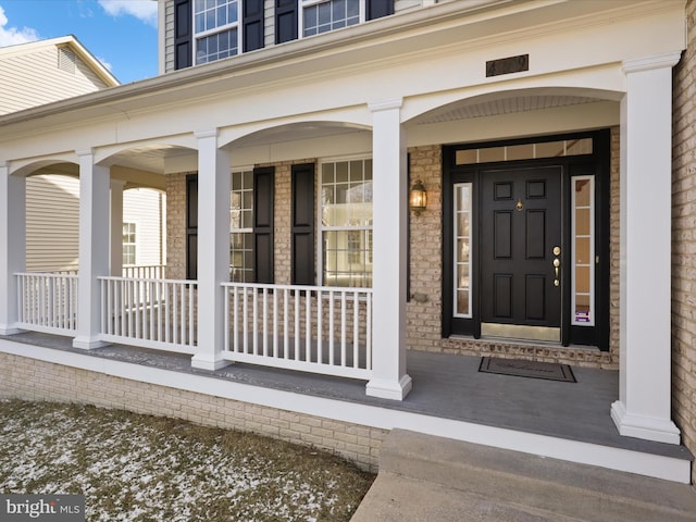 property entrance featuring covered porch