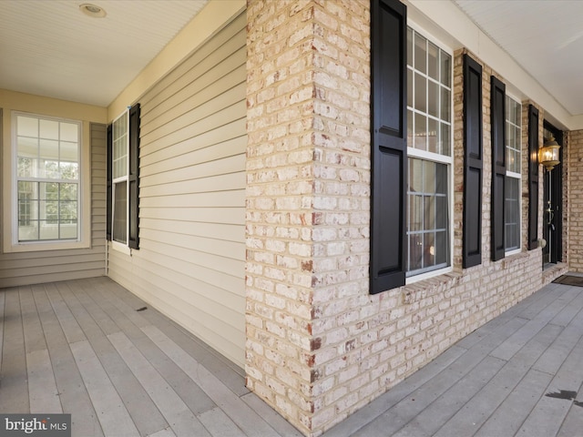 view of side of property featuring a porch