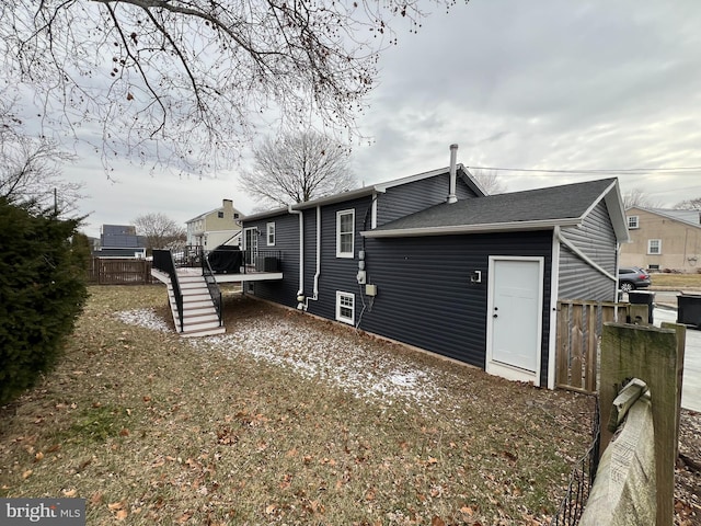 view of home's exterior with a wooden deck