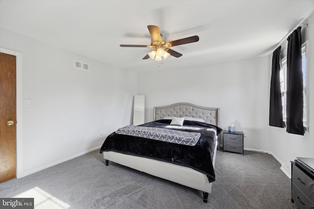 bedroom featuring dark carpet and ceiling fan