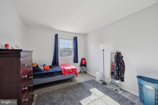 bedroom with light wood-type flooring