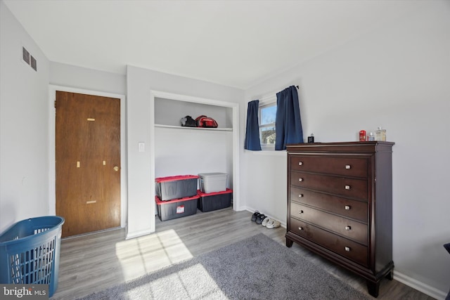 bedroom with light wood-type flooring