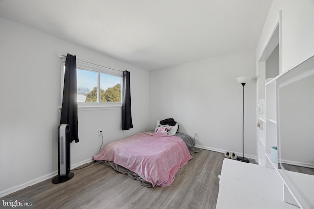 bedroom featuring wood-type flooring