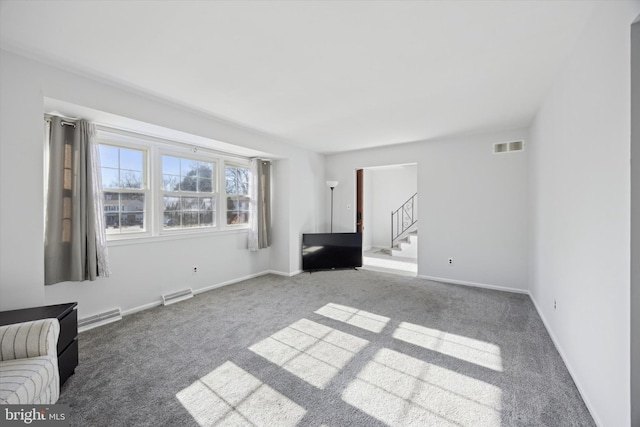 unfurnished living room featuring carpet floors