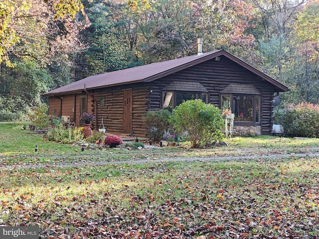 view of side of home featuring a yard