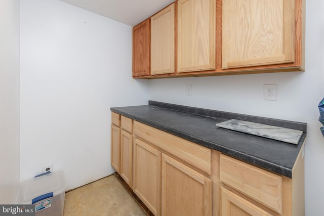 interior space featuring light brown cabinets