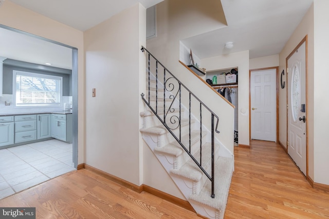 stairs featuring hardwood / wood-style flooring