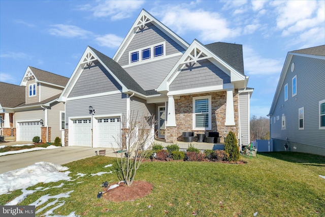 craftsman house with a garage, covered porch, and a front yard