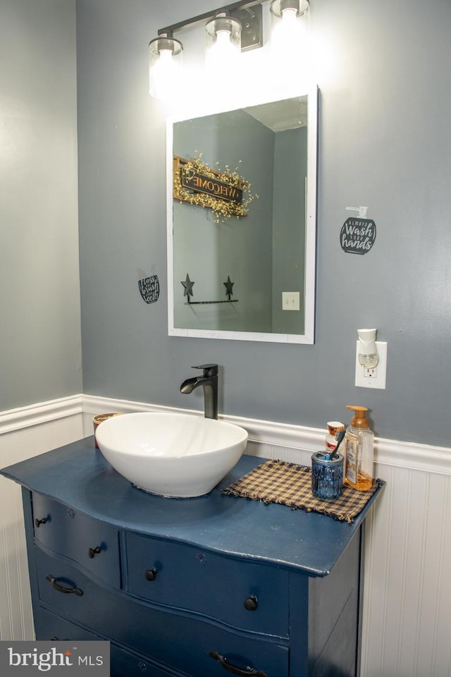 bathroom with wainscoting and vanity