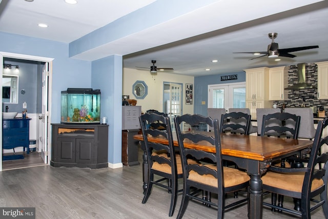 dining room featuring ceiling fan, recessed lighting, wood finished floors, baseboards, and french doors