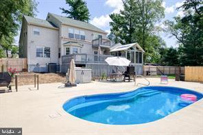 view of pool with a fenced in pool, a patio, and fence