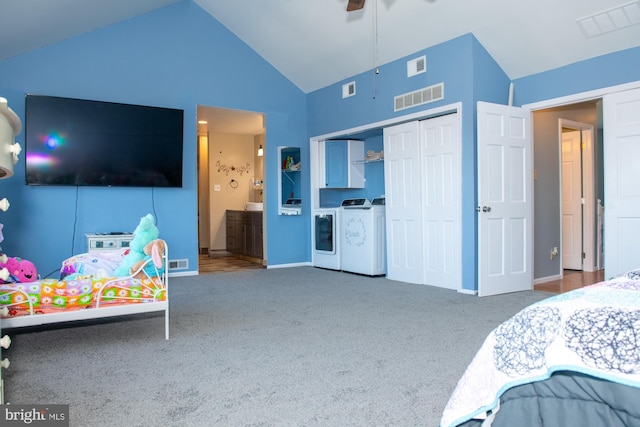 bedroom featuring carpet, a closet, visible vents, and washer and clothes dryer