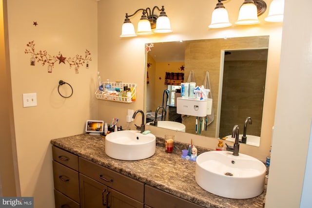 bathroom featuring double vanity and a sink