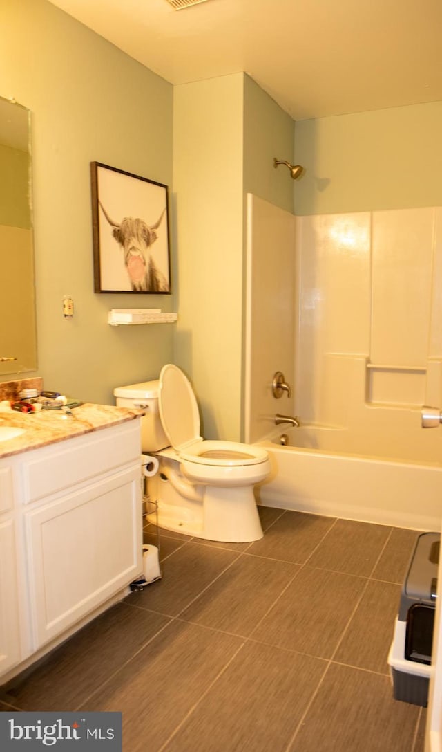 bathroom featuring  shower combination, visible vents, vanity, and toilet