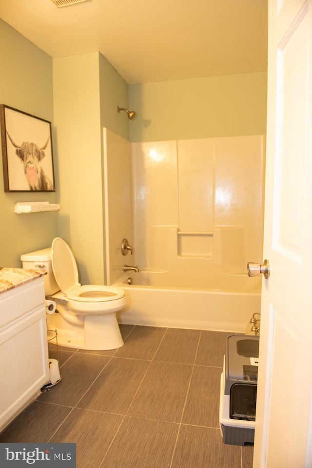 bathroom with visible vents, toilet, shower / tub combination, tile patterned flooring, and vanity