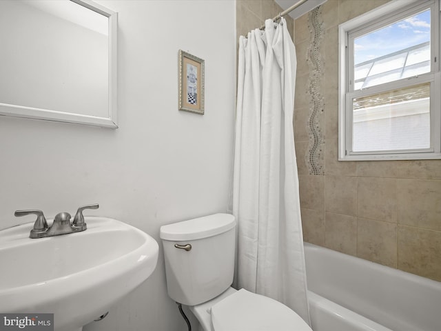 full bathroom featuring sink, toilet, and shower / tub combo