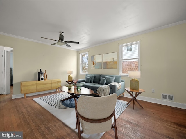 living room featuring ceiling fan, ornamental molding, plenty of natural light, and hardwood / wood-style floors