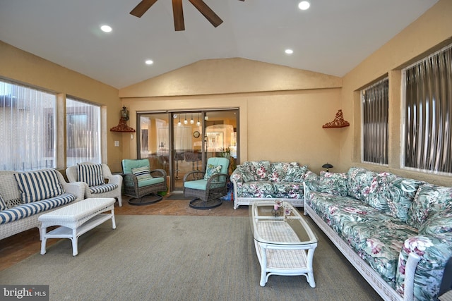 living room featuring vaulted ceiling and ceiling fan