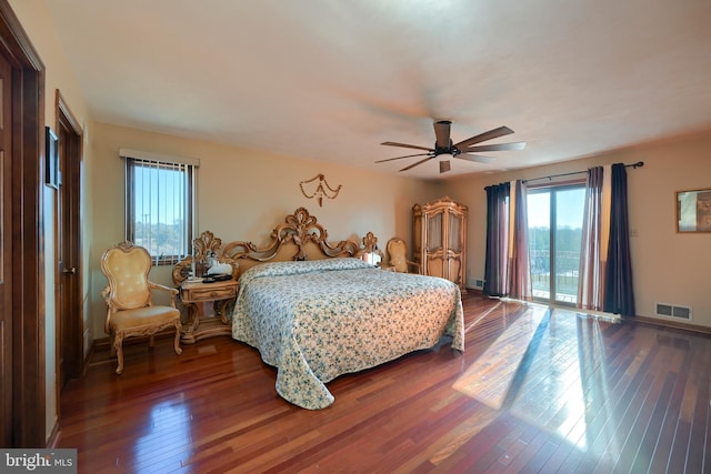 bedroom with hardwood / wood-style flooring, access to outside, and ceiling fan