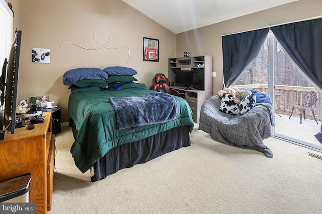 bedroom with carpet floors, access to exterior, and vaulted ceiling