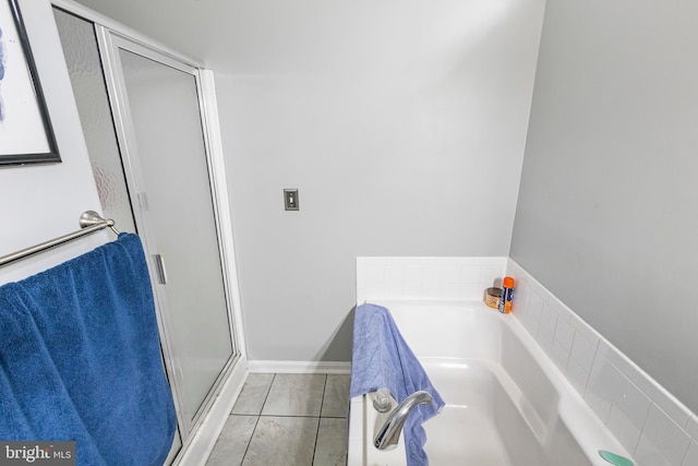 bathroom with tile patterned floors and plus walk in shower