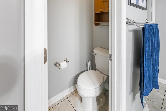 bathroom featuring tile patterned flooring and toilet