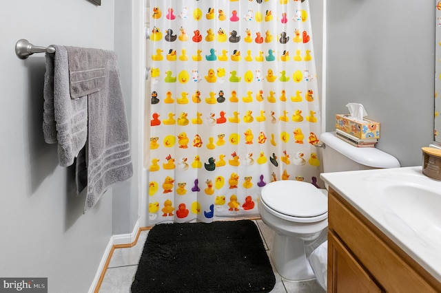 bathroom with vanity, a shower with curtain, tile patterned floors, and toilet