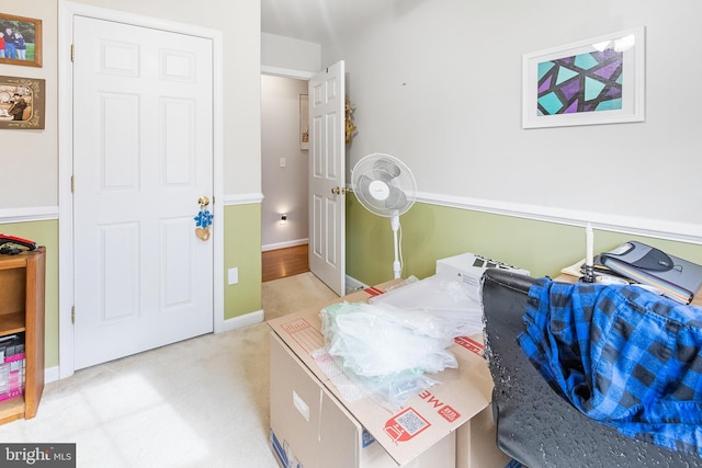 bedroom featuring light carpet