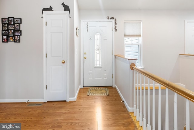 foyer entrance with light wood-type flooring