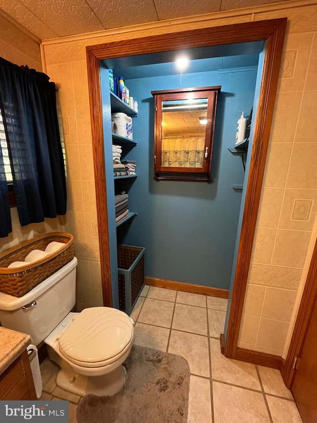 bathroom with tile patterned floors and toilet