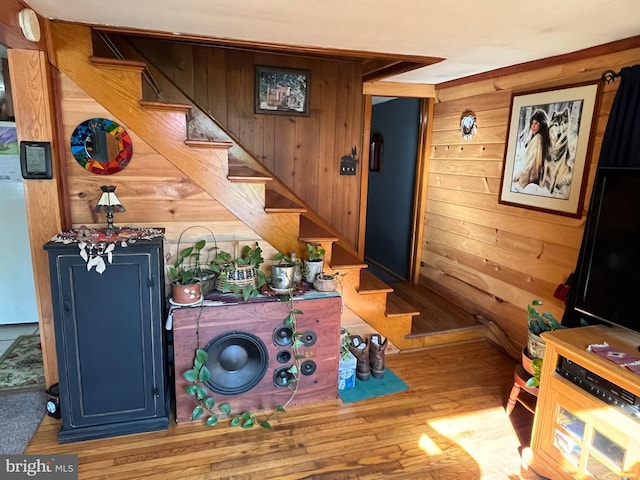 interior space with wood walls and blue cabinetry