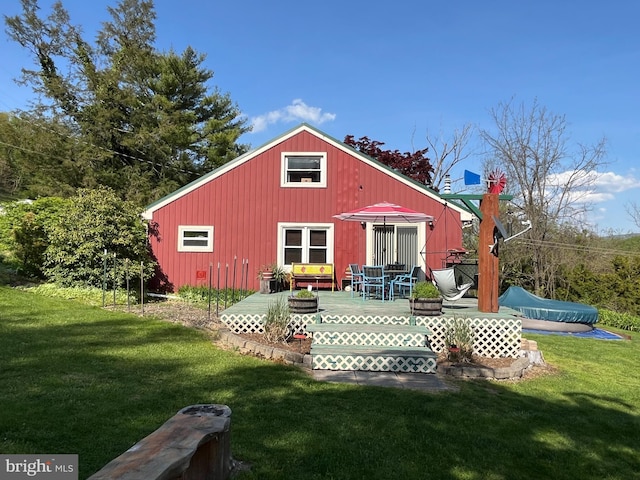 view of outbuilding featuring a yard