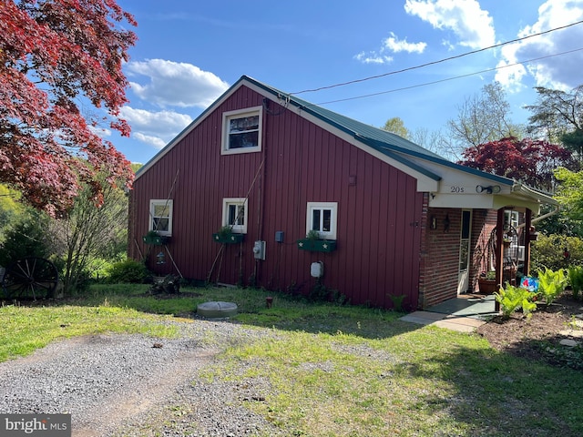 view of property exterior featuring a lawn