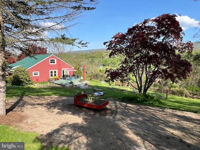 view of yard featuring a wooden deck