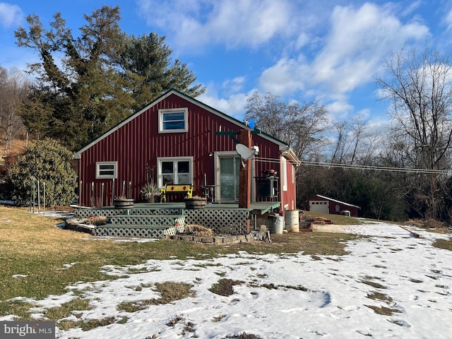 view of front of house with a lawn, an outbuilding, and a garage