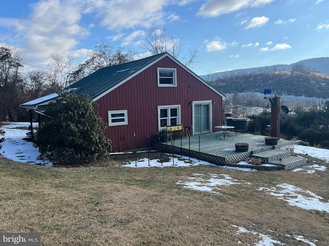 exterior space featuring a yard and a mountain view