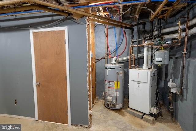 utility room featuring water heater