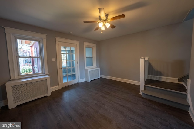 interior space featuring radiator heating unit, dark hardwood / wood-style flooring, and ceiling fan