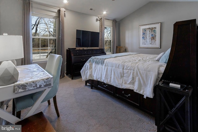 carpeted bedroom with multiple windows and lofted ceiling