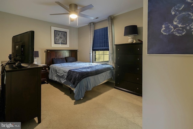 bedroom with light carpet and ceiling fan