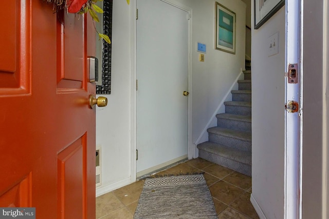 foyer featuring tile patterned flooring