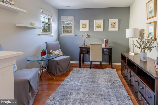 living area featuring hardwood / wood-style floors