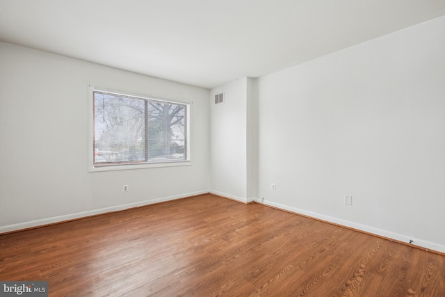 empty room featuring hardwood / wood-style floors