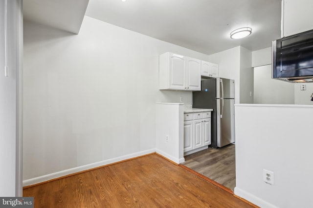 kitchen with white cabinetry, dark hardwood / wood-style flooring, and stainless steel appliances