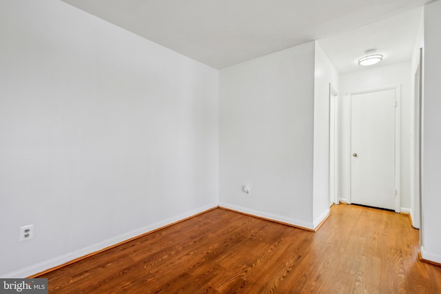 unfurnished room with light wood-type flooring