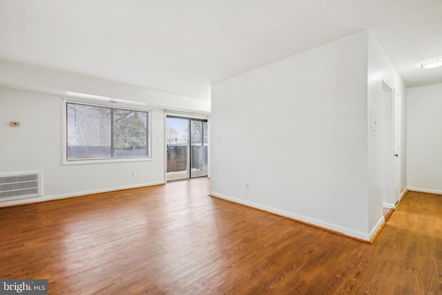 empty room featuring wood-type flooring