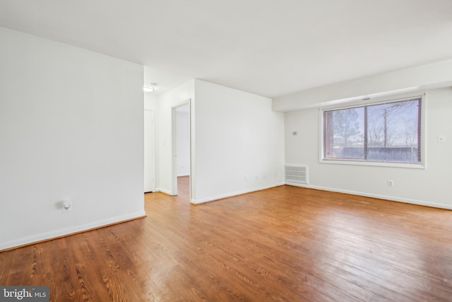 empty room featuring hardwood / wood-style flooring