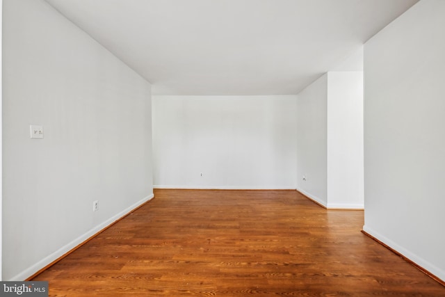 empty room with wood-type flooring