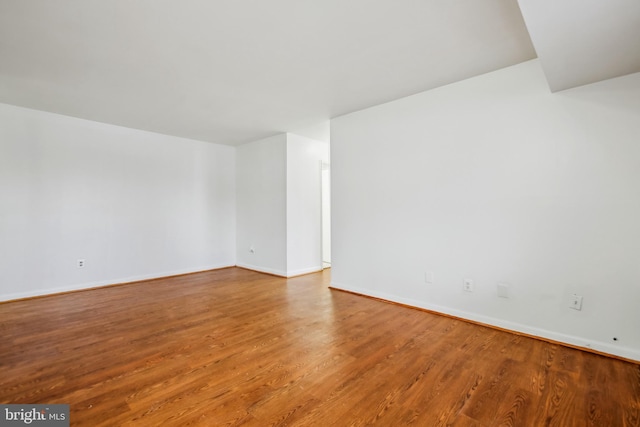 unfurnished room featuring hardwood / wood-style floors