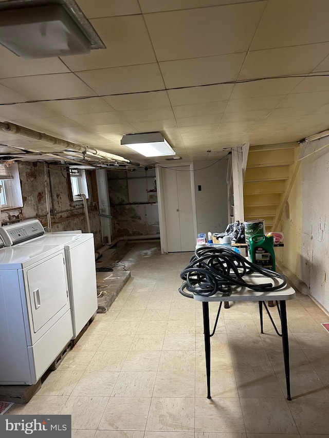 basement with washer and clothes dryer